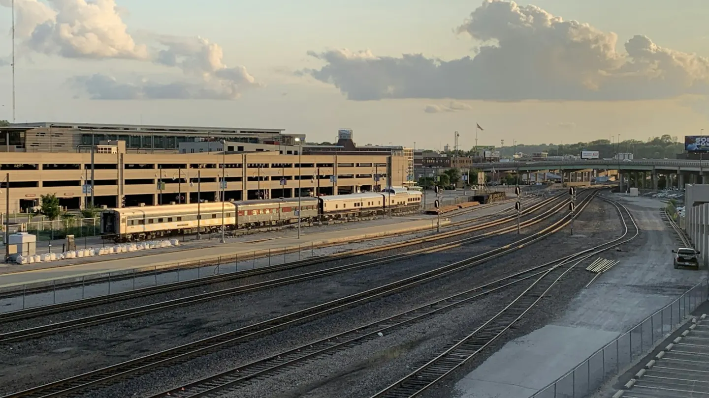 brown concrete building under white clouds during daytime