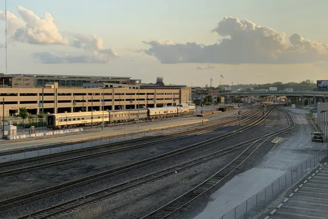 brown concrete building under white clouds during daytime