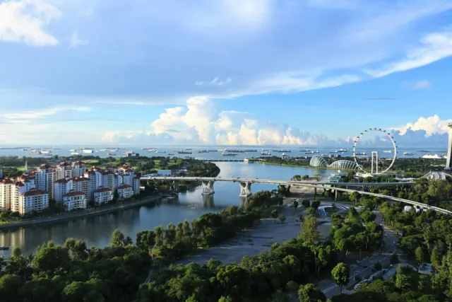 aerial view of city buildings near body of water during daytime