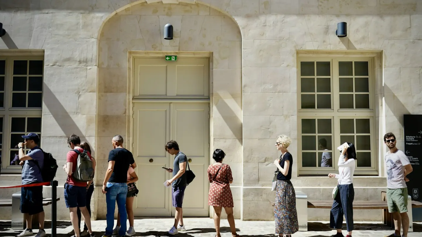 a group of people standing outside a building